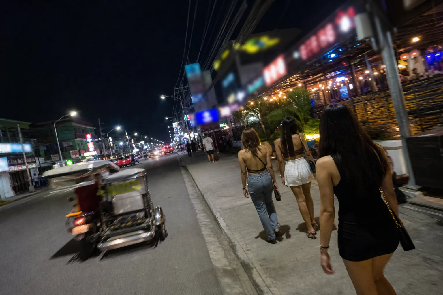 Walking Street nightlife arrival, first-person phone POV